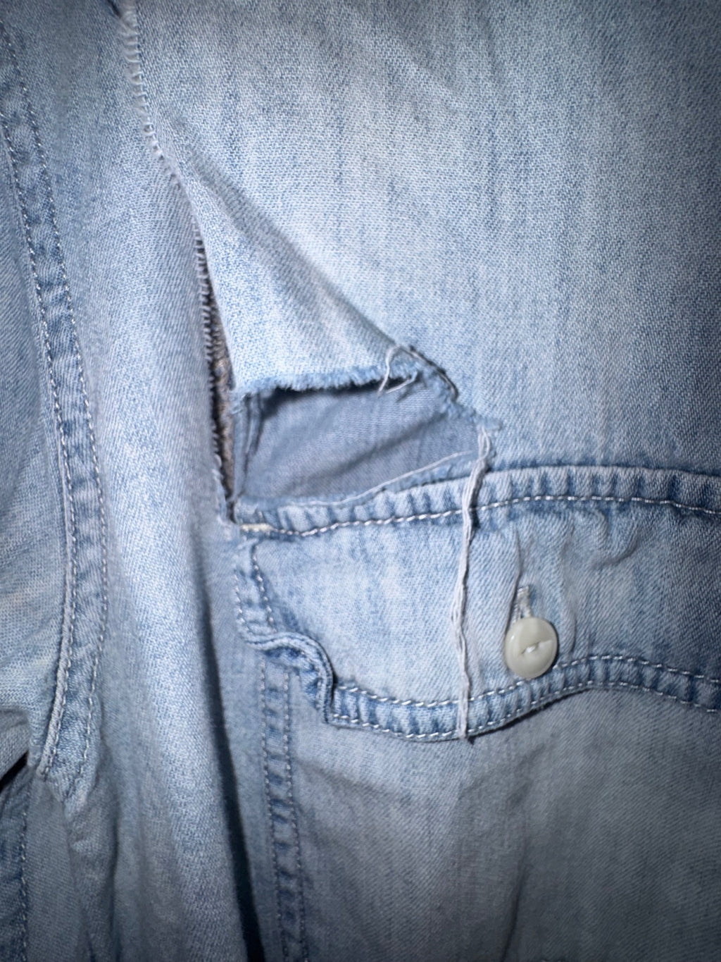 Treasure and Bond chest pocket tear close-up
