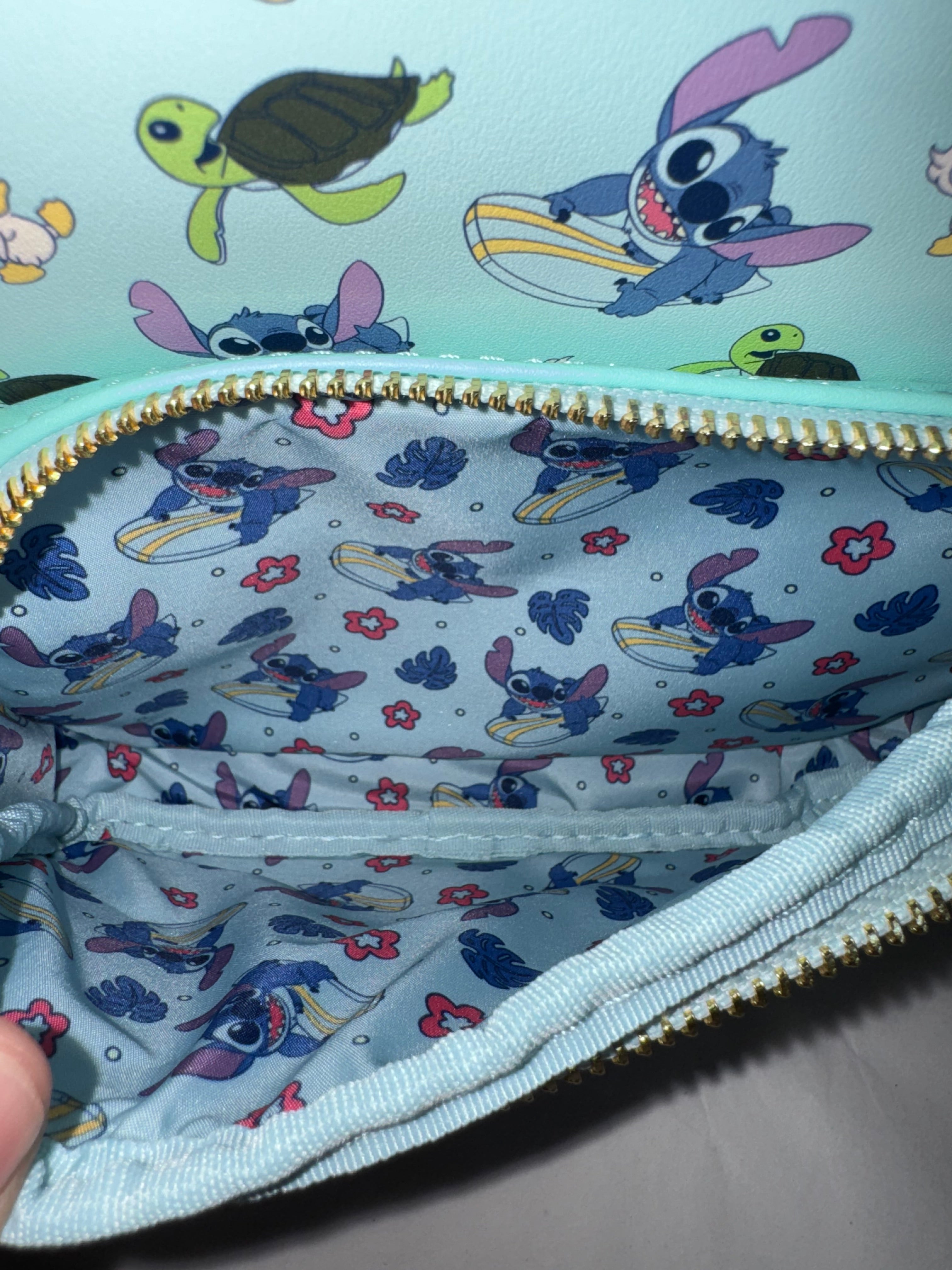Loungefly Disney Lilo & Stitch Animal Friends Mini Backpack – Stitch Surfing with Ducklings & Sea Turtles