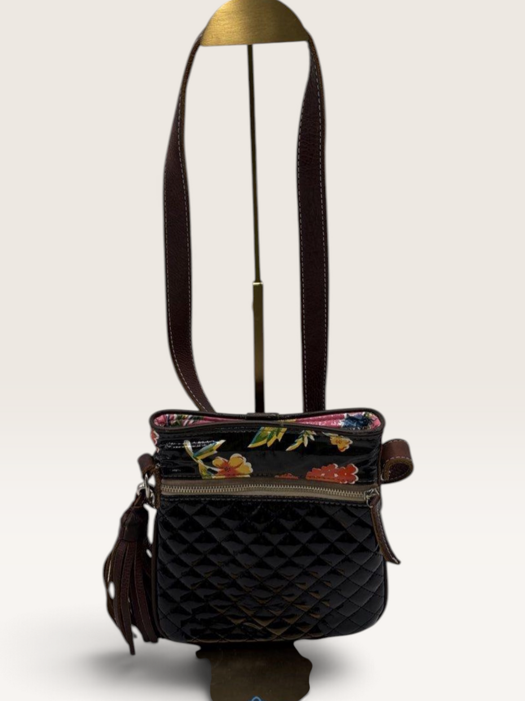 Consuela Black Quilted Crossbody Bag with Embroidered Logo & Tassel